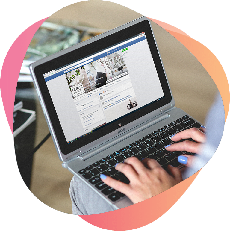Person browsing Facebook on a laptop